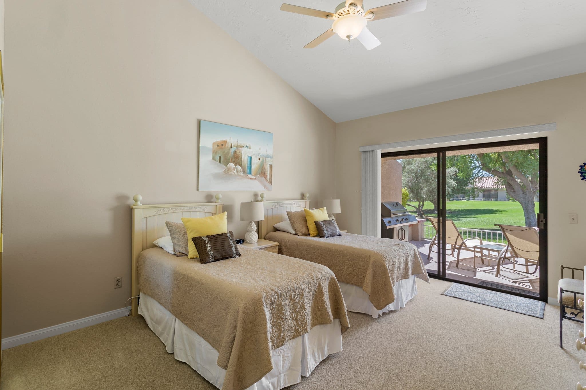 Guest bedroom view of sliding doors to patio area at 40386 Pebble Beach