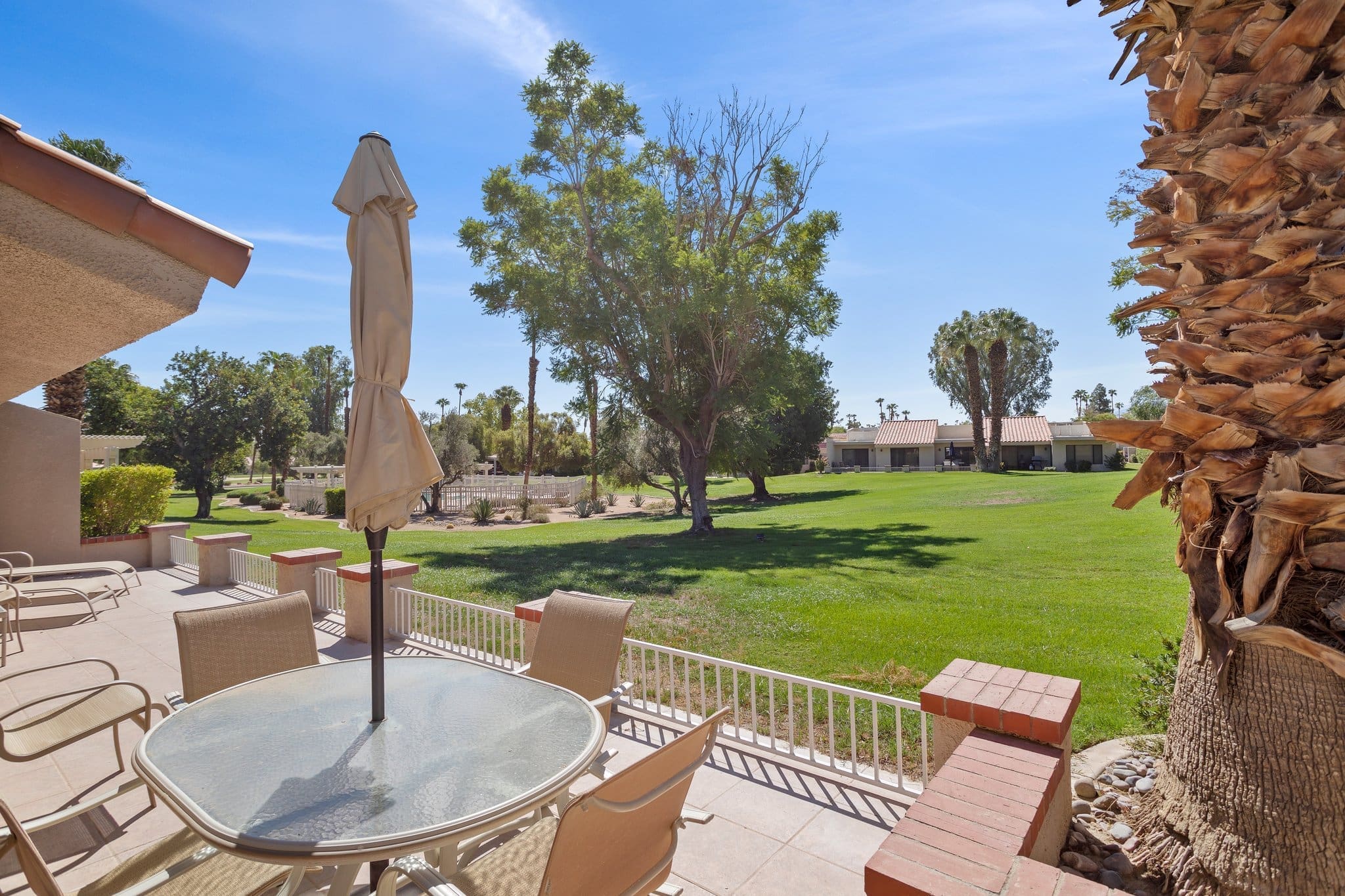 Exterior view from patio of yard and amenities at 40386 Pebble Beach