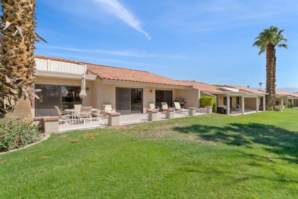 Exterior rear patio and yard side view at 40386 Pebble Beach