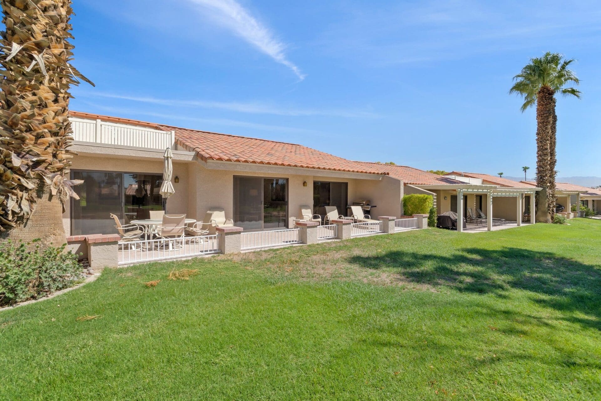 Exterior rear patio and yard side view at 40386 Pebble Beach