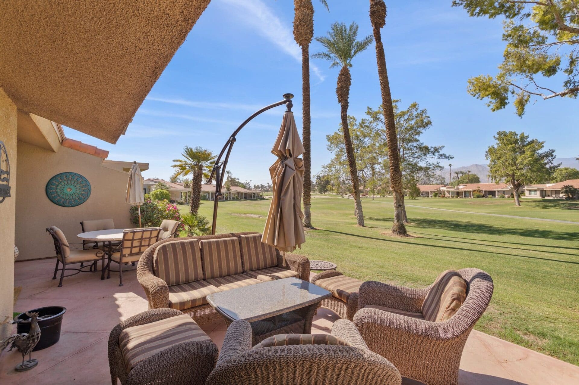 Side view of patio with wicker chairs at 41443 Inverness Way