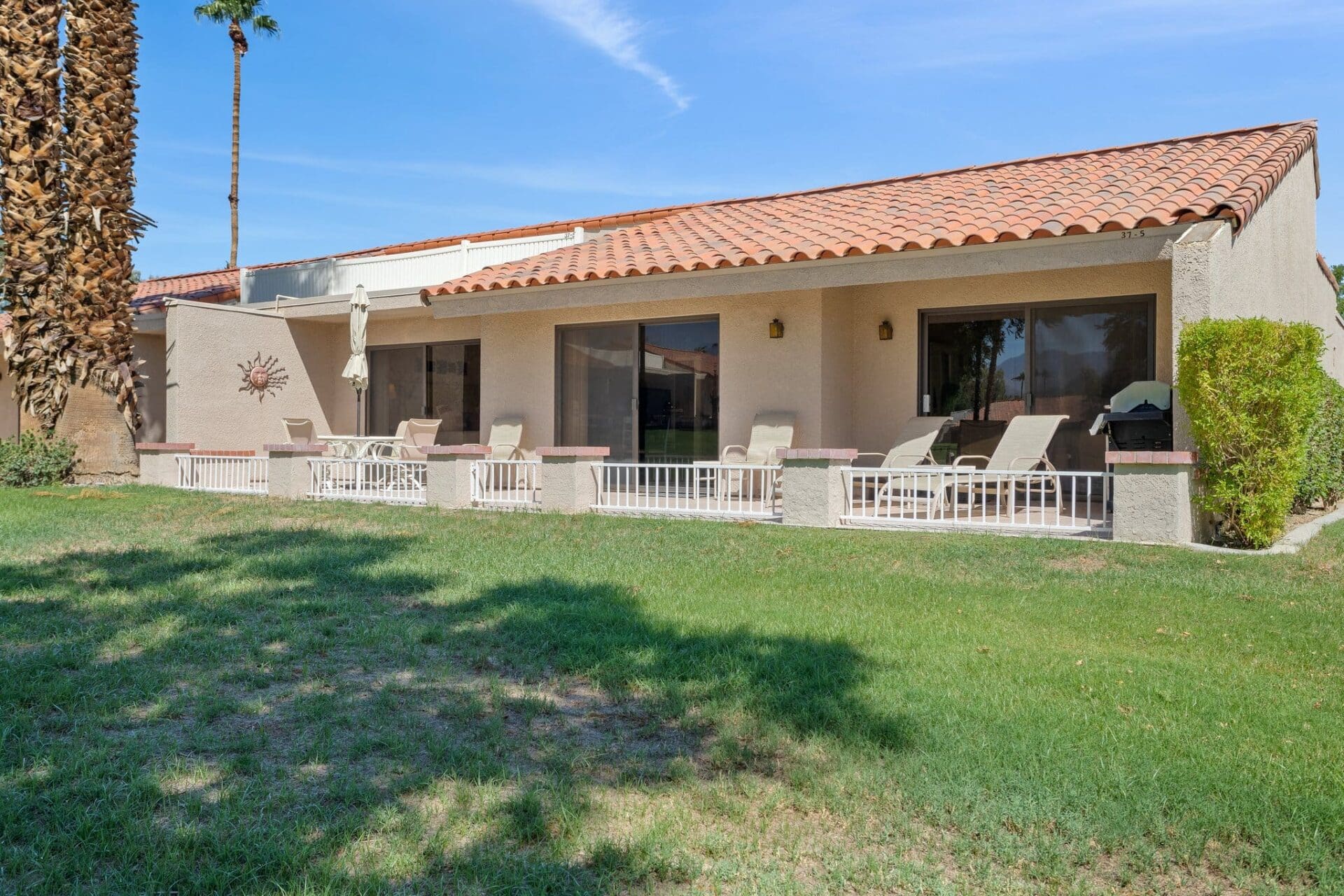 Exterior rear patio and yard at 40386 Pebble Beach