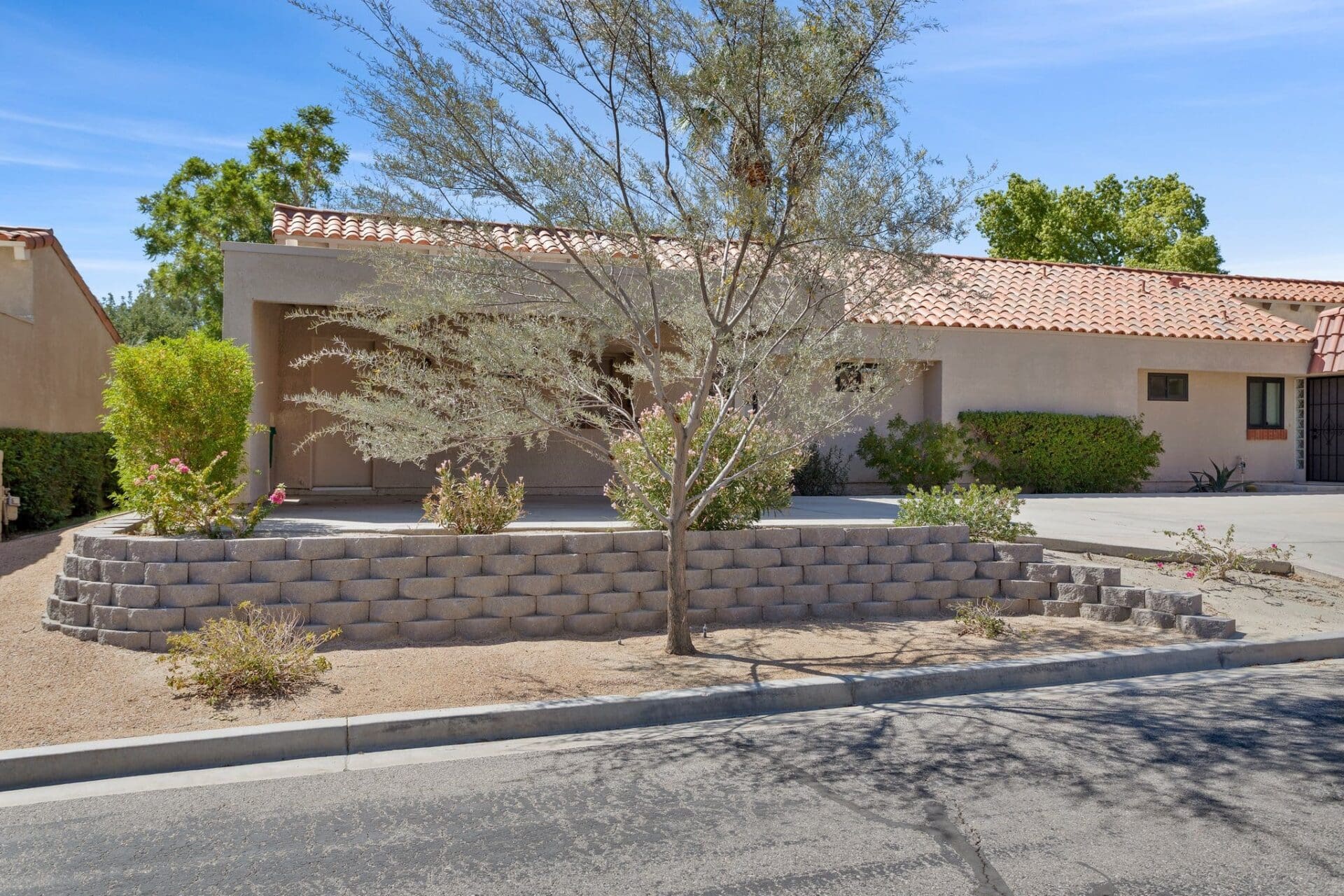 Exterior front view of home with driveway at 40386 Pebble Beach