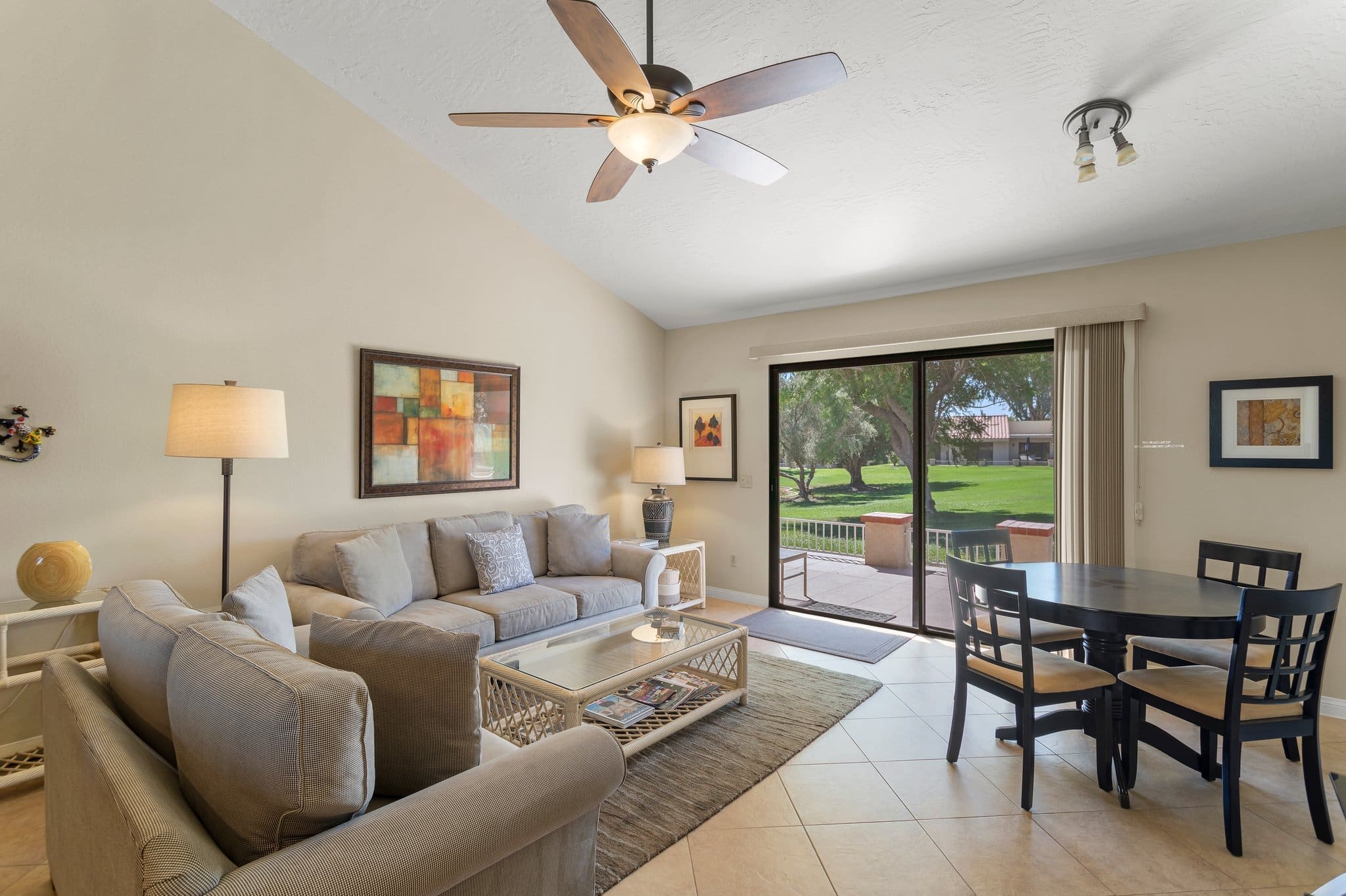 Living room area with dining table and sliding glass door at 40386 Pebble Beach