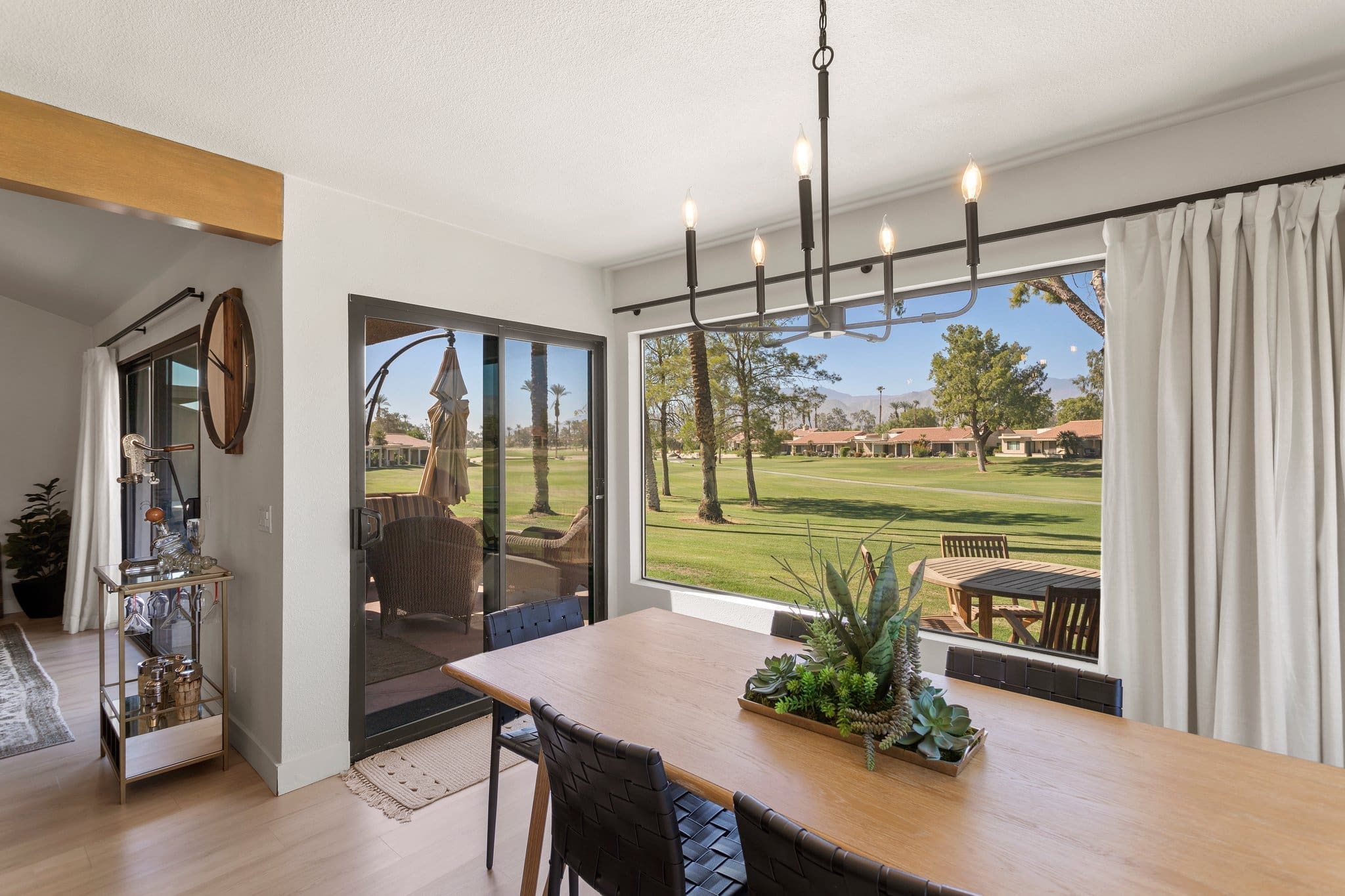 Dining room with large bay windows overlooking the beautiful Palm Desert at 41443 Inverness Way