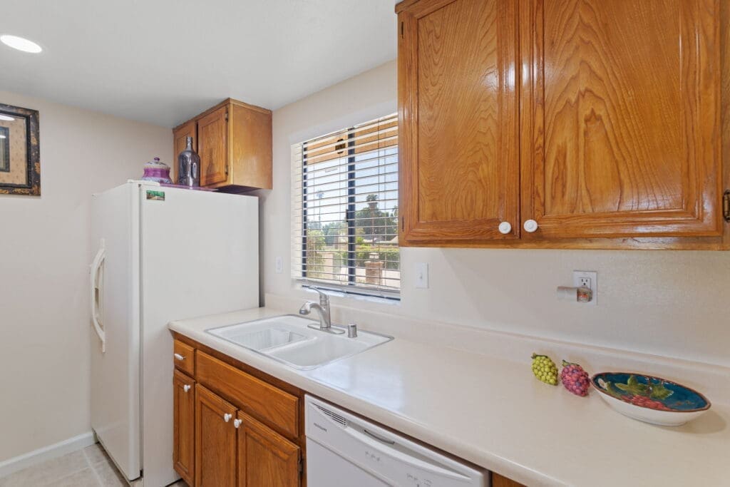 View of kitchen area with double bay sink at 77042 Pauma Valley Way
