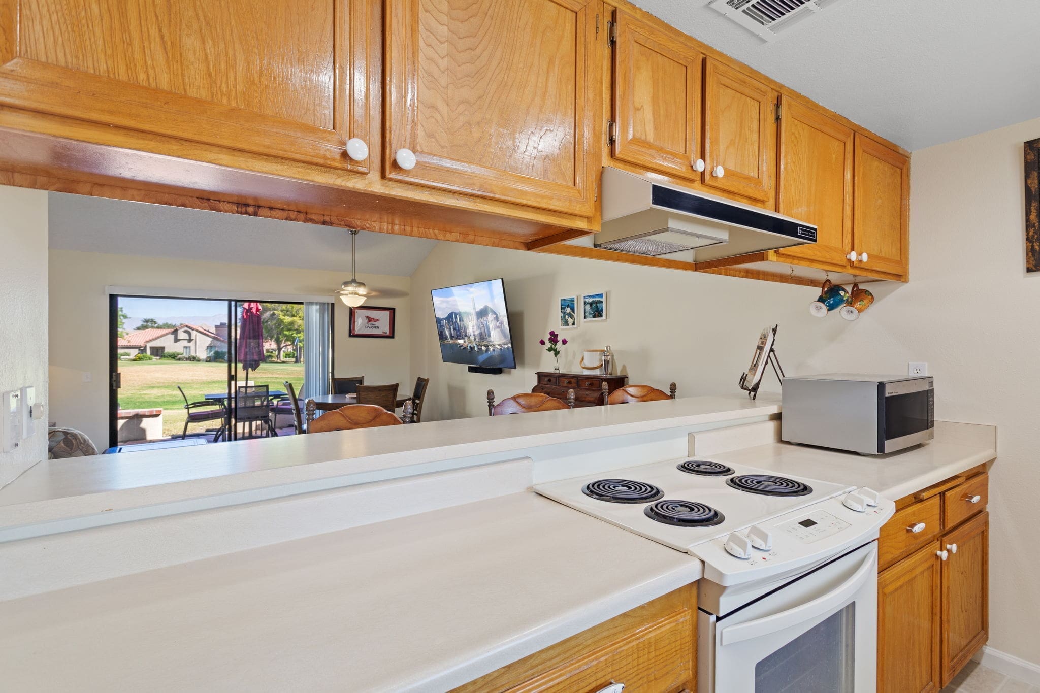 View from kitchen into dinning area at 77042 Pauma Valley Way