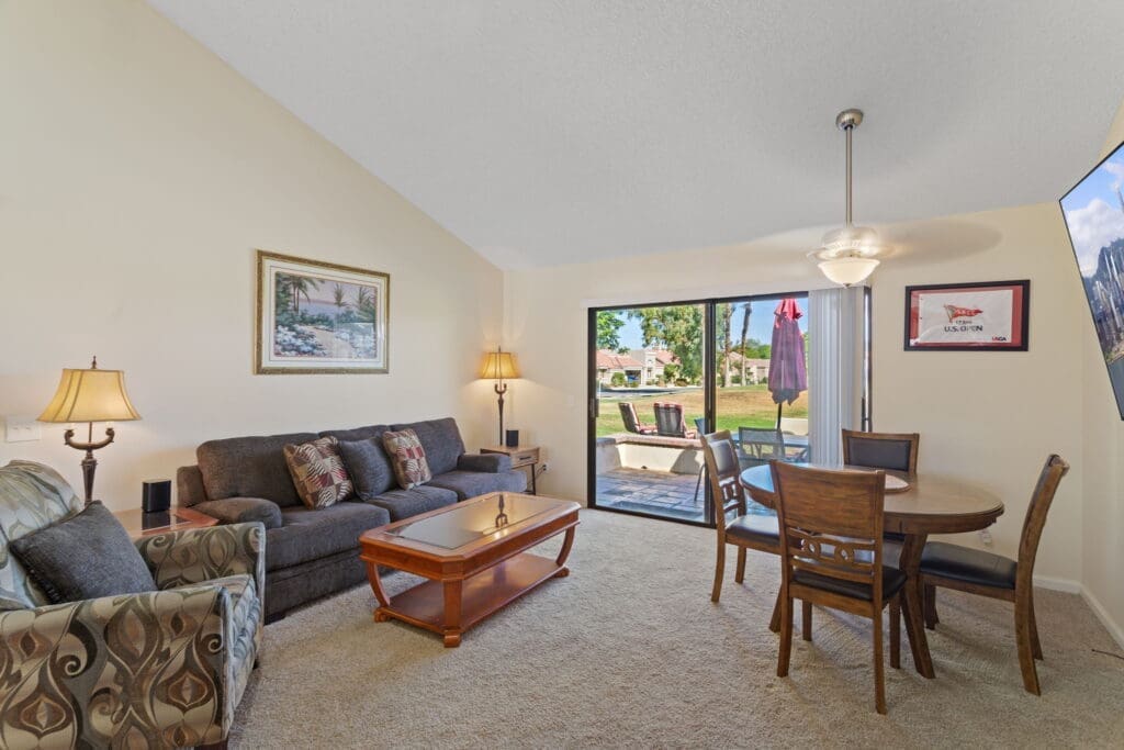 Living room area with glass sliding door to patio at 77042 Pauma Valley Way