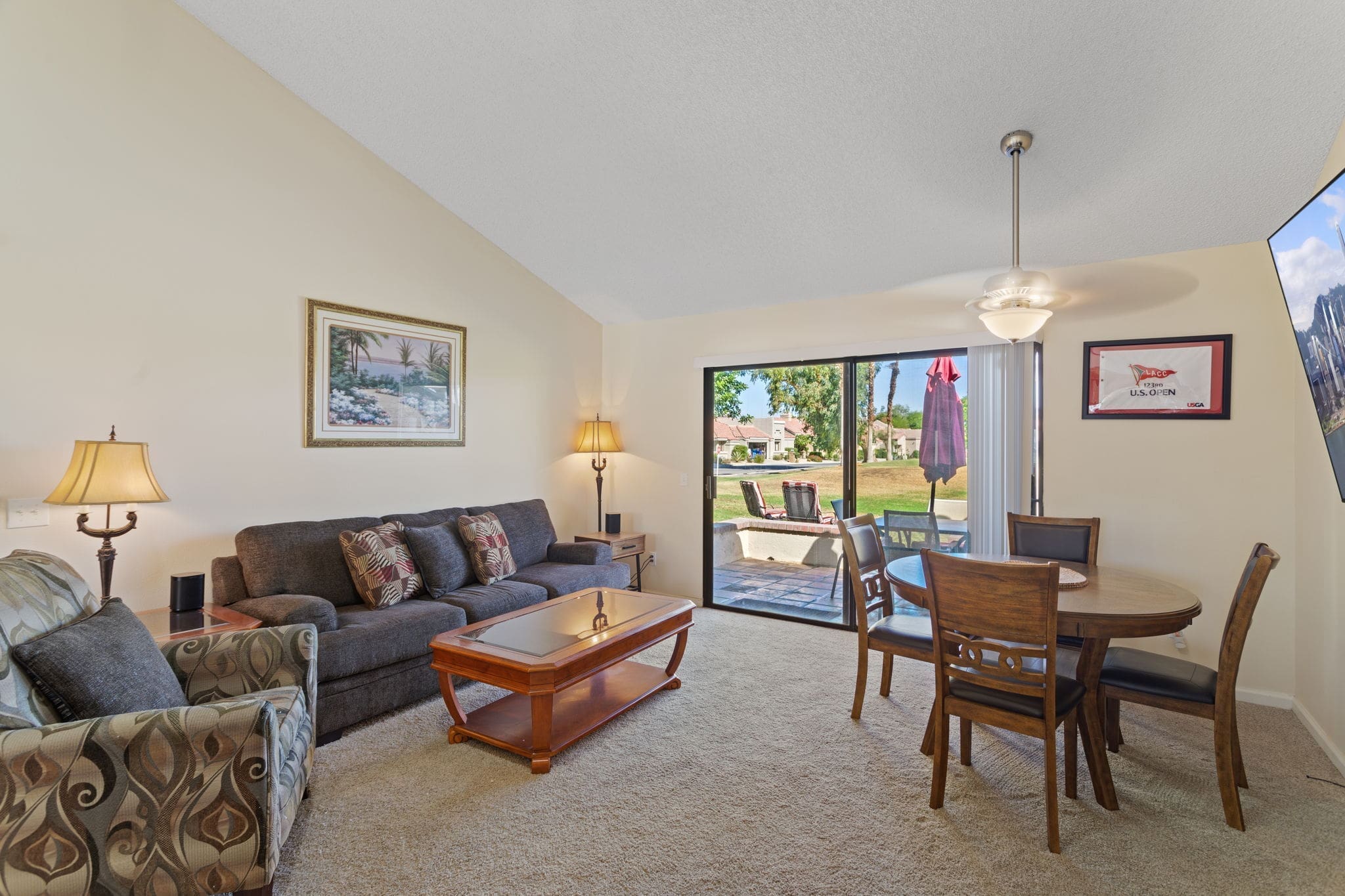 Living room area with glass sliding door to patio at 77042 Pauma Valley Way