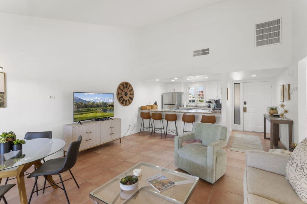 View of open living room and dining table with overview of kitchen at 41447 Inverness Way