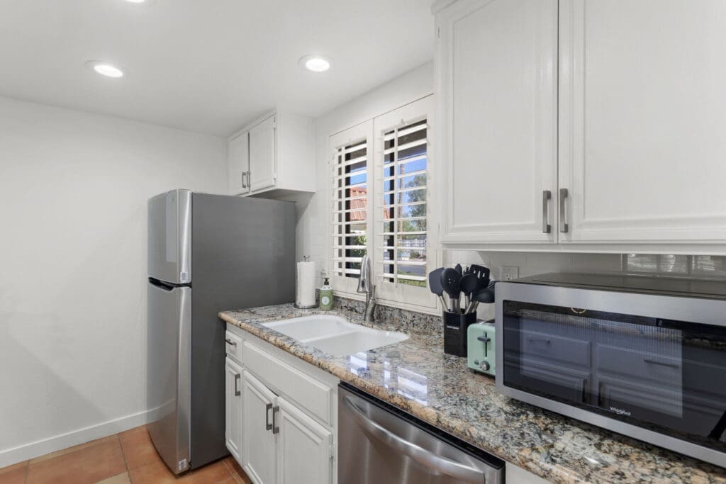 View of sink and refrigerator in kitchen at 41447 Inverness Way