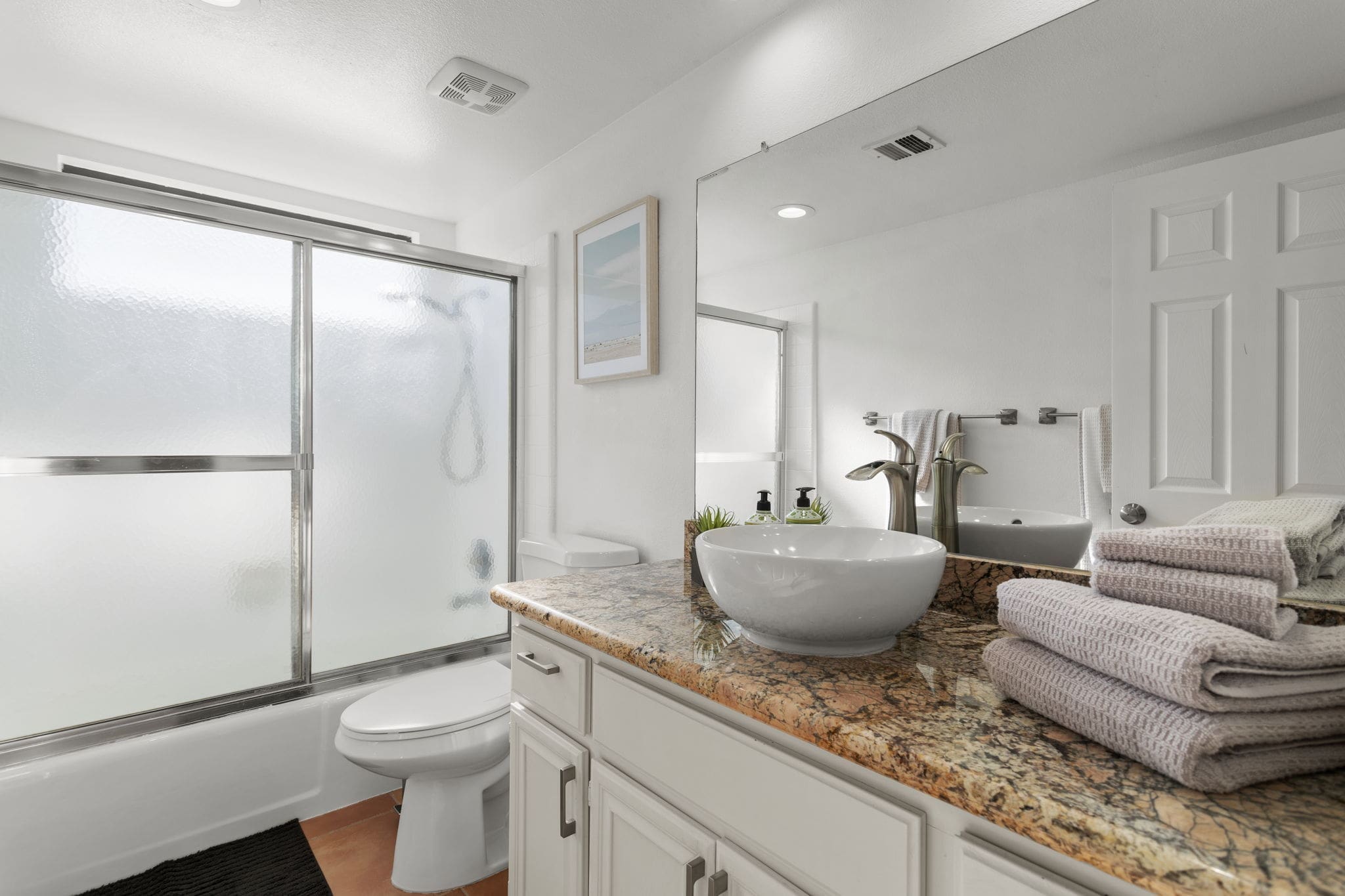 Bathroom with bowl sink and marble counters at 41447 Inverness Way