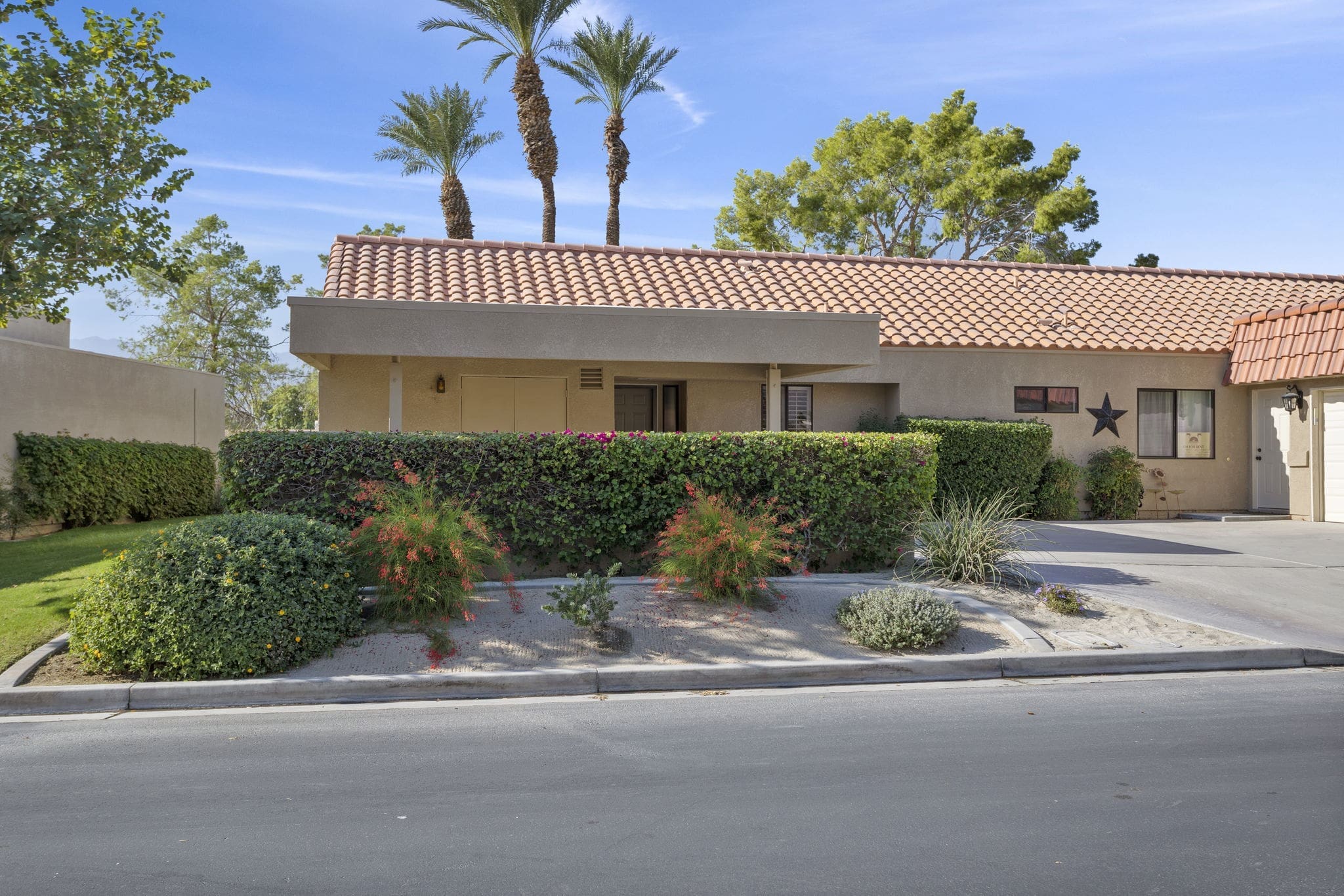 Front view with bushes at 41447 Inverness Way