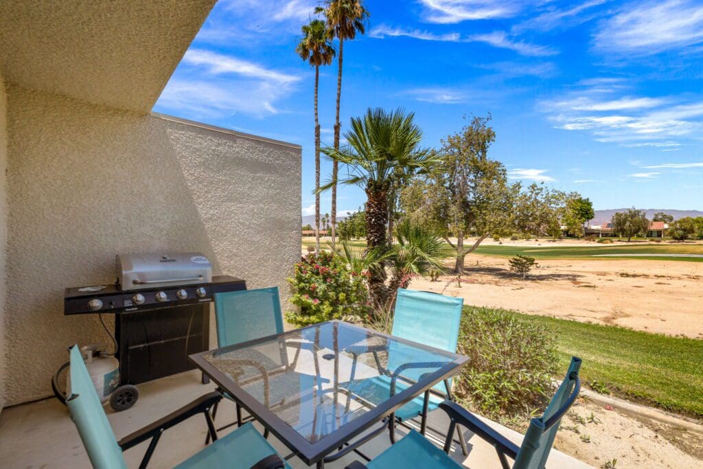 patio with chairs overlooking golf course