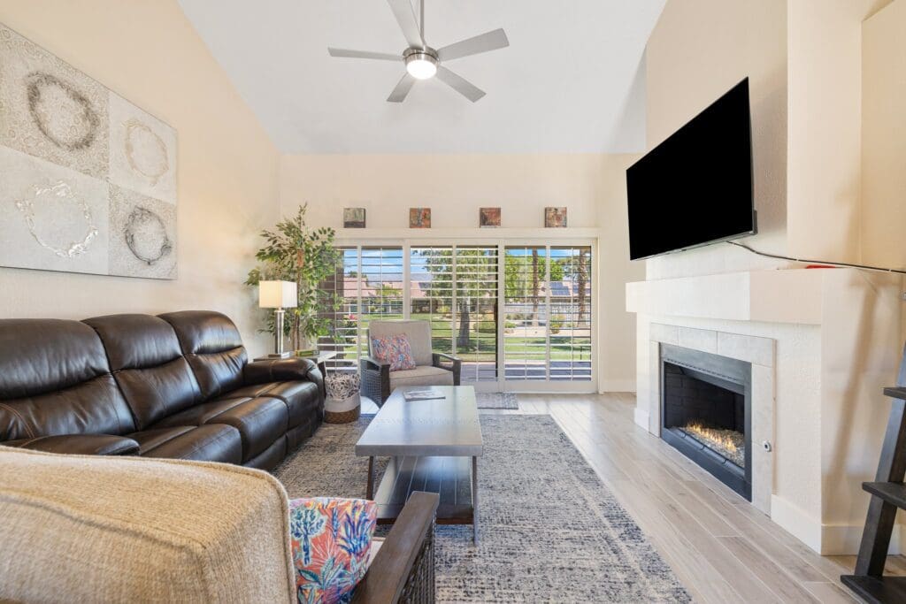 living room with fireplace and large tv
