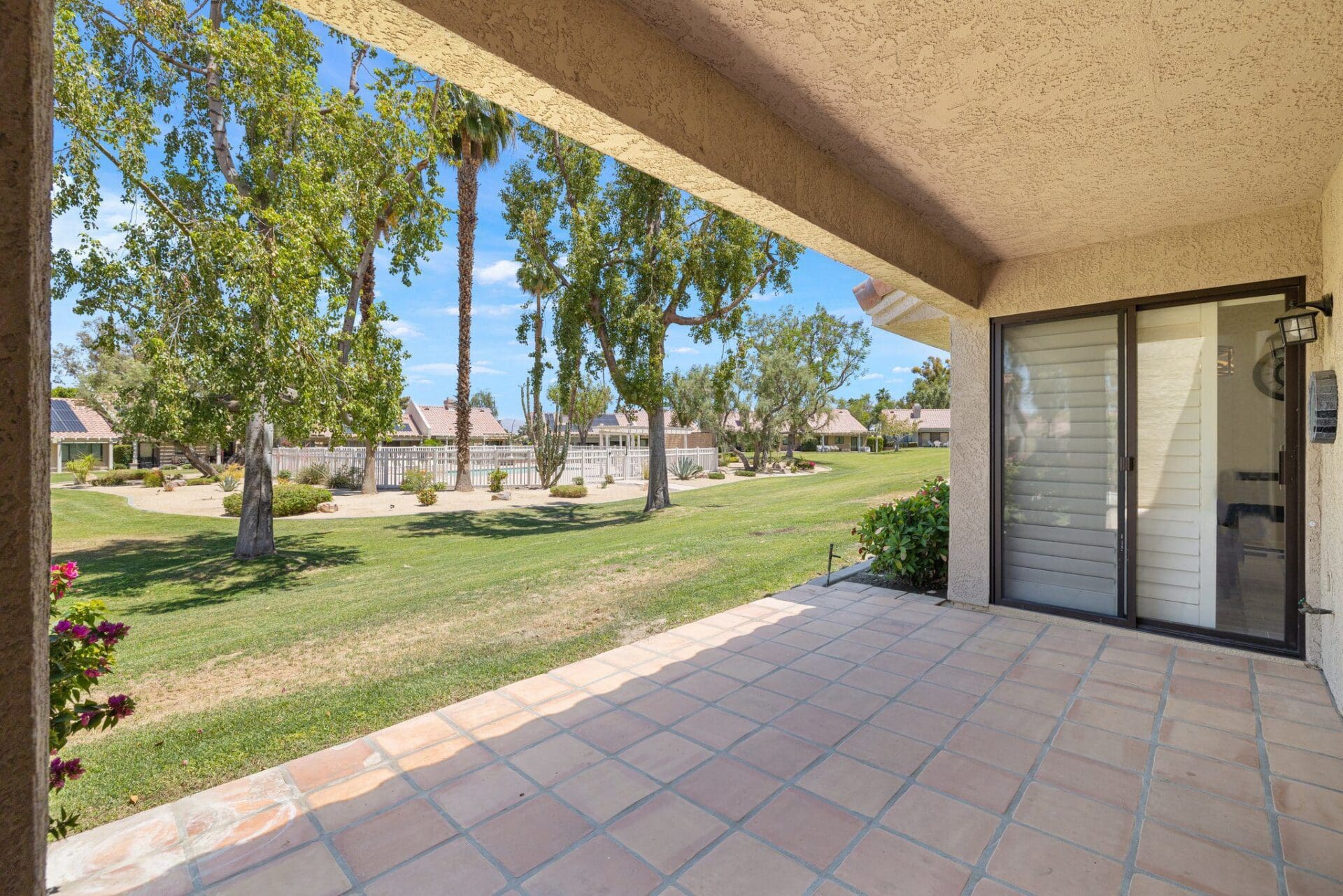 patio angled view of greenbelt and pool