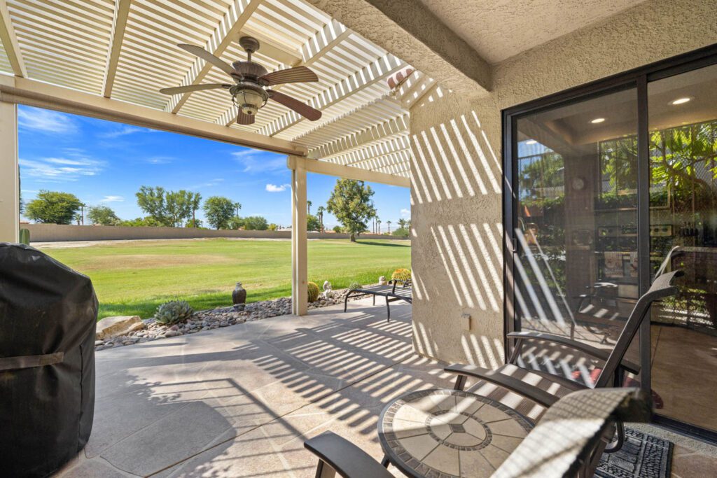 patio overlooking green and doors