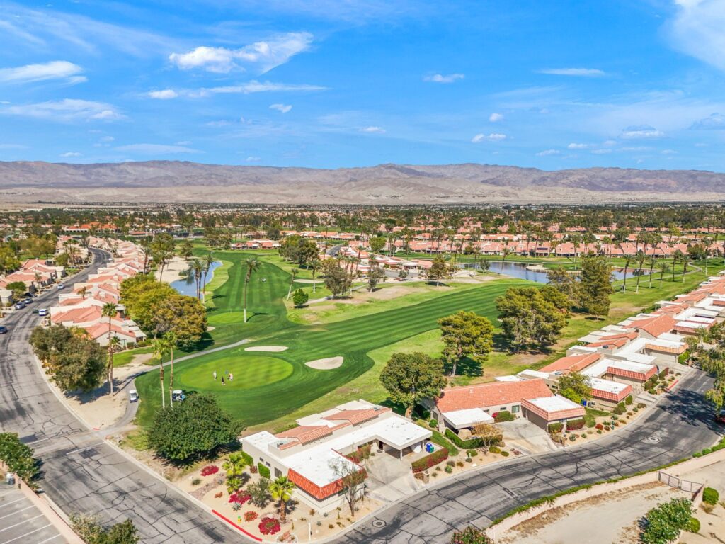 77042 property aerial view with garage